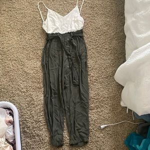 White and first green romper with felt belt in middle half zip in back xs